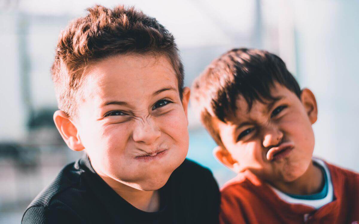 Two boys making funny faces