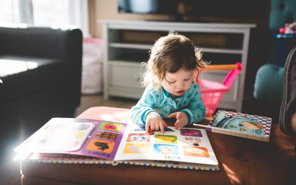 Little girl reading a book