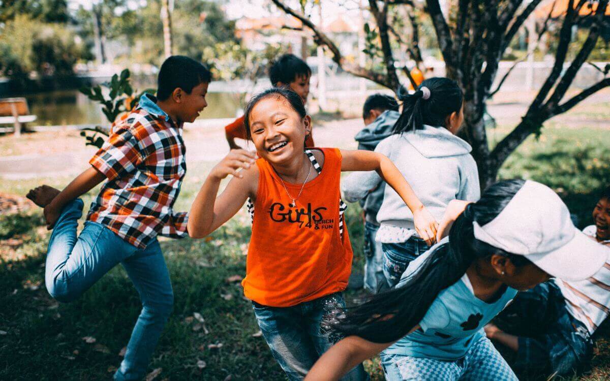 Children running and smiling outside